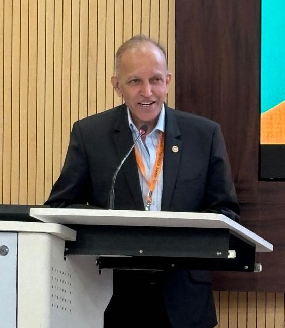 Dr. Satish Ogale giving a speech